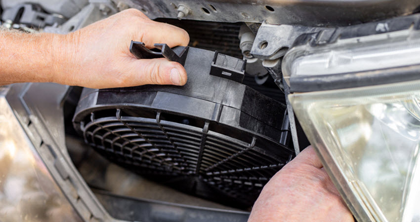 Volvo Mechanic Installing Cooling Fan